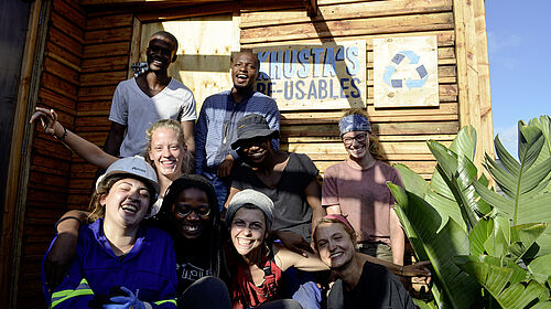 The group of exchange students in front of Khusta's Workshop